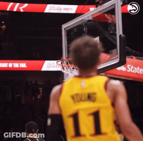 A Basketball Player Wearing A Yellow Jersey With The Number 11 GIF