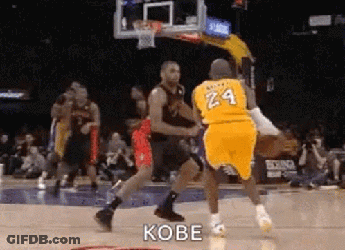 A Basketball Player Wearing A Yellow Jersey With The Number 24 On It Is Dribbling A Basketball . GIF