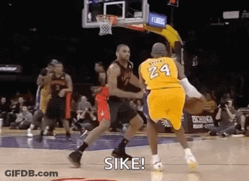 A Basketball Player Wearing A Yellow Jersey With The Number 24 On It Is Dribbling The Ball . GIF