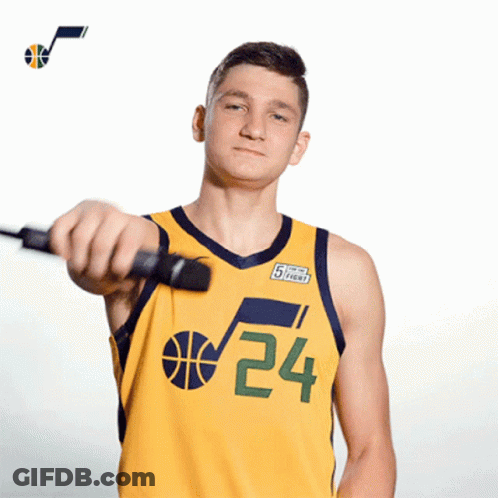 A Basketball Player Wearing A Yellow Jersey With The Number 24 On It GIF