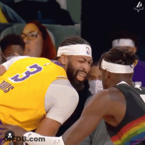 A Basketball Player Wearing A Yellow Jersey With The Number 3 On It GIF