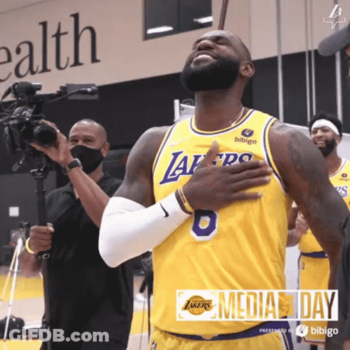 A Basketball Player Wearing A Yellow Jersey With The Number 8 On It GIF