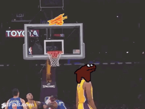 A Basketball Player Wearing A Yellow Lakers Jersey Stands In Front Of A Basketball Hoop GIF