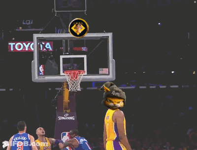 A Basketball Player Wearing A Yellow Lakers Jersey Throws A Ball GIF