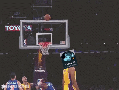 A Basketball Player Wearing A Yellow Lakers Jersey Throws A Basketball Through A Hoop GIF