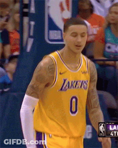 A Basketball Player Wearing A Yellow Lakers Jersey With The Number 0 On It GIF