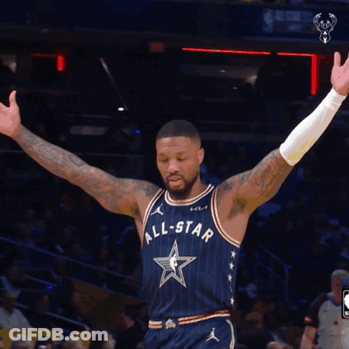 A Basketball Player Wearing An All Star Uniform Stands On The Court With His Arms Outstretched GIF