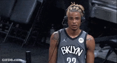 Basketball Player With Headphones And Brooklyn Jersey GIF