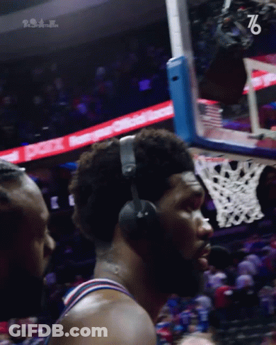 A Basketball Player Wearing Headphones With The Number 76 On The Bottom Left GIF