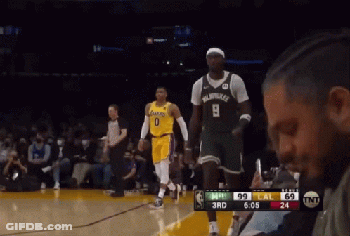 A Basketball Player Wearing Number 9 Stands On The Court During A Game GIF