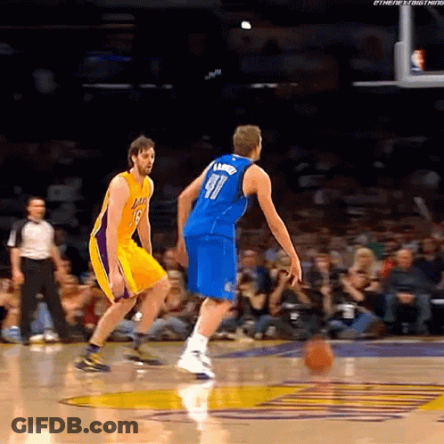 A Basketball Player Wearing Number 91 Dribbles The Ball GIF