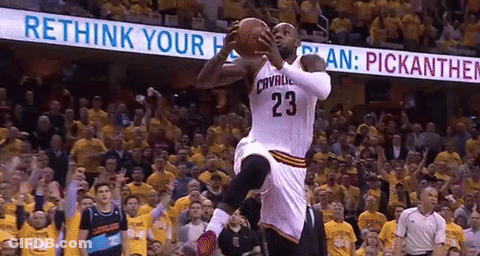 A Basketball Player Wearing The Number 23 Jumps In The Air To Catch The Ball GIF