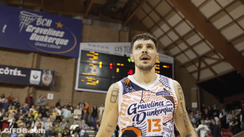 A Basketball Player Wears A Jersey That Says Gravelines Dunkerque GIF