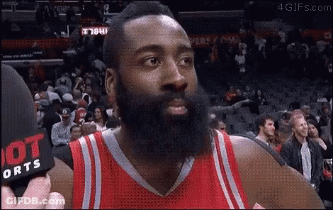 Basketball Player With Beard Being Interviewed In Red Jersey GIF