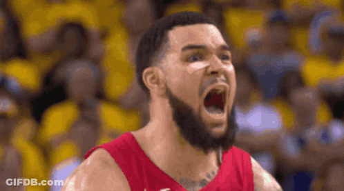A Basketball Player With A Beard Is Screaming With His Mouth Wide Open . GIF