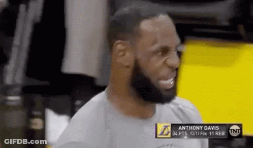 A Basketball Player With A Beard Is Sitting In The Locker Room . GIF