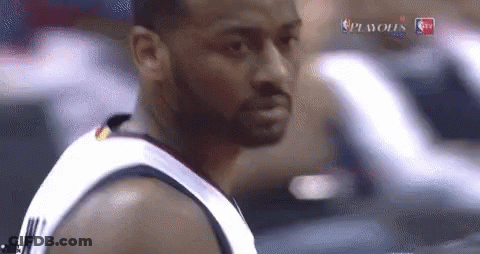 A Basketball Player With A Beard Is Standing In Front Of A Car . GIF