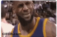 A Basketball Player With A Beard Wearing A Blue And Gold Jersey Is Smiling . GIF
