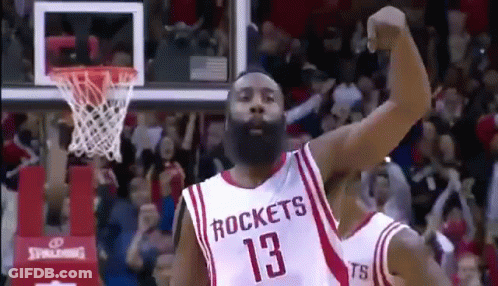 A Basketball Player With A Beard Wearing A Rockets Jersey Is Celebrating A Basket . GIF