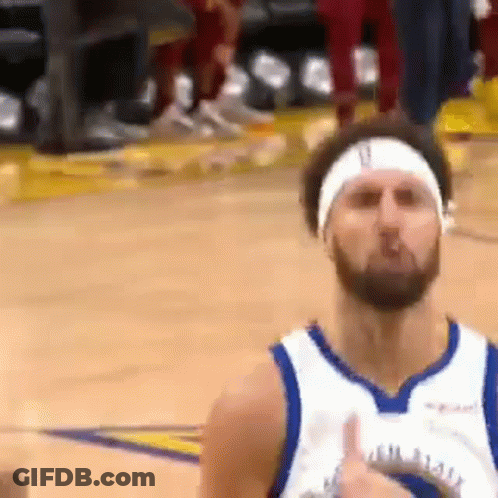 A Basketball Player With A Headband On His Head Is Giving A Thumbs Up Sign . GIF