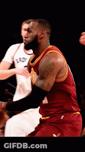 A Basketball Player With A Tattoo On His Arm Is Wearing A Red Jersey GIF