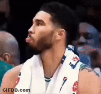 A Basketball Player With A Towel Around His Neck Looks To His Left GIF