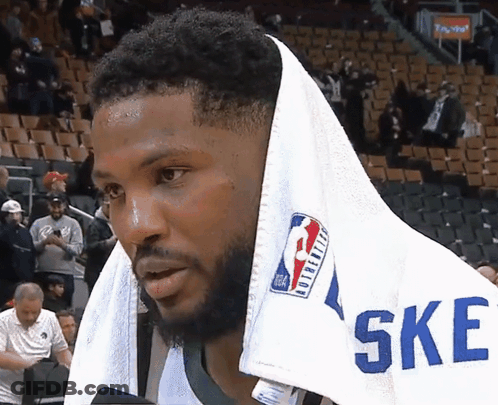 A Basketball Player With A Towel Wrapped Around His Head And The Word Ske On His Shirt GIF