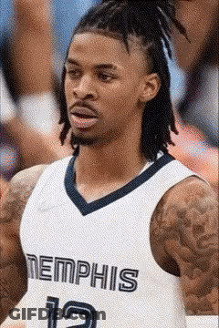 A Basketball Player With Dreadlocks Is Wearing A Jersey That Says Memphis GIF