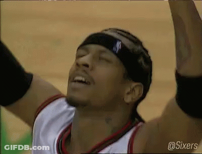 A Basketball Player With His Arms In The Air Is Wearing A Headband With The Letter S On It . GIF