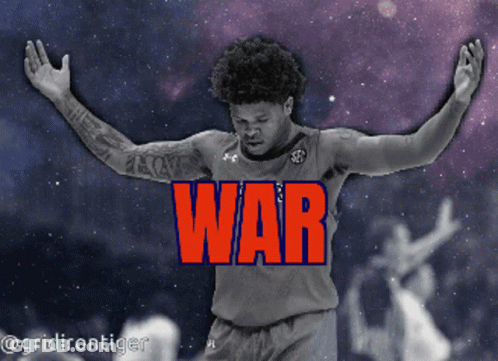 A Basketball Player With His Arms Outstretched In Front Of A Sign That Says War GIF