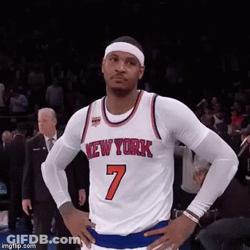 A Basketball Player With His Hands On His Hips Is Wearing A New York Jersey . GIF