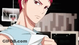 A Basketball Player With Red Hair Is Standing In Front Of A Basketball Hoop In A Gym . GIF