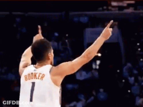 A Basketball Player With The Name Booker On His Shirt GIF
