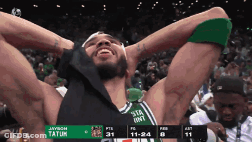 A Basketball Player With The Name Tatum On The Back Of His Shirt GIF