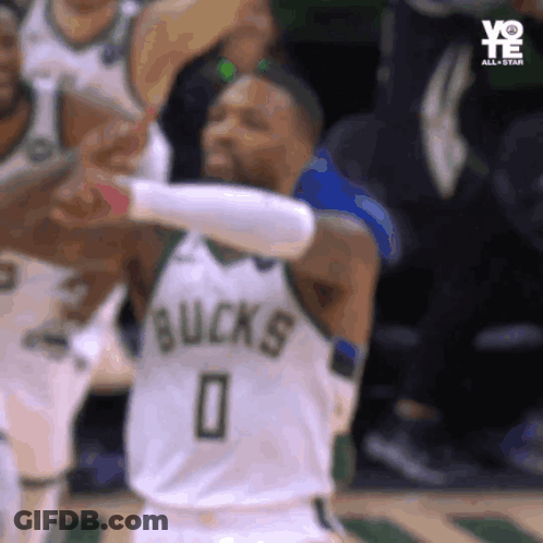 A Basketball Player With The Number 0 On His Jersey Is Giving A High Five GIF