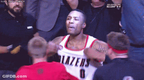 A Basketball Player With The Number 0 On His Jersey Is Surrounded By Fans GIF