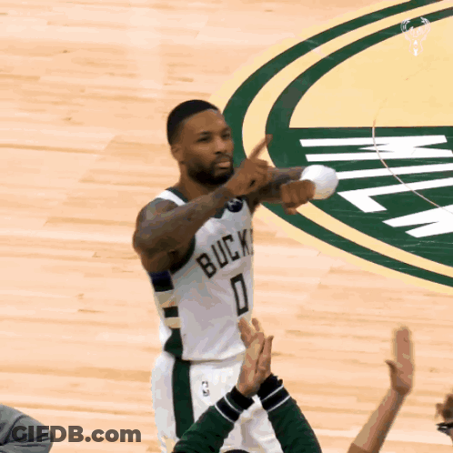 A Basketball Player With The Number 0 On His Jersey Stands On The Court GIF