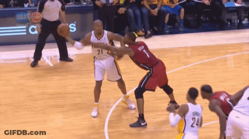 A Basketball Player With The Number 1 On His Jersey Is Defending Another Player GIF