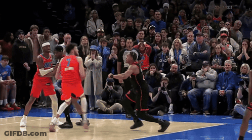 A Basketball Player With The Number 1 On His Jersey Is Surrounded By Other Players GIF