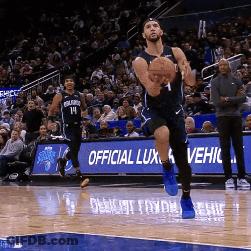 A Basketball Player With The Number 1 On His Jersey Jumps In The Air GIF
