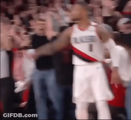 A Basketball Player With The Number 1 On His Jersey Stands In Front Of A Crowd . GIF