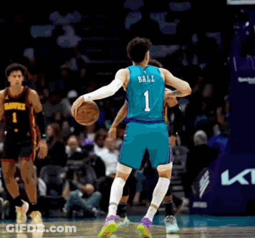 A Basketball Player With The Number 1 On The Back Of His Jersey Is Holding A Basketball . GIF