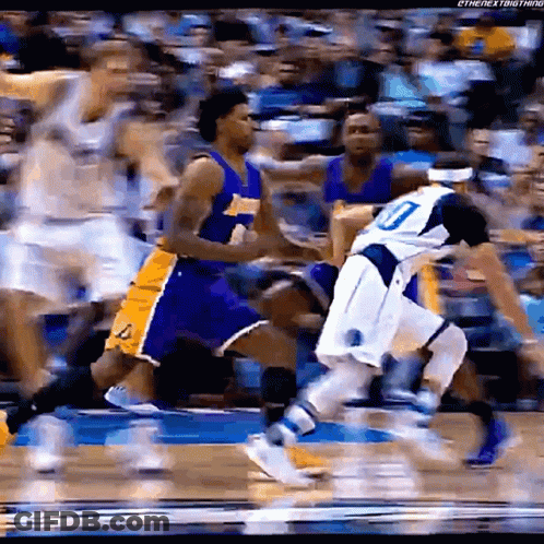 A Basketball Player With The Number 10 On His Jersey Is Being Chased By Another Player GIF