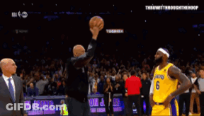A Basketball Player With The Number 10 On His Jersey Shakes Hands With A Fan GIF