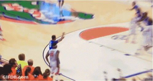 A Basketball Player With The Number 10 On His Jersey Stands On The Court GIF