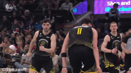 A Basketball Player With The Number 11 On His Back Is Standing Next To Another Player GIF