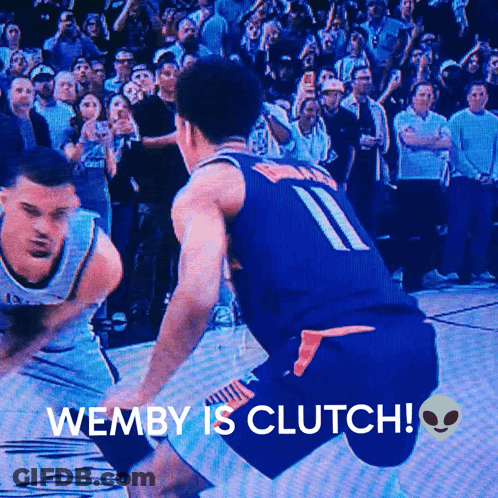 A Basketball Player With The Number 11 On His Jersey Dribbles The Ball GIF
