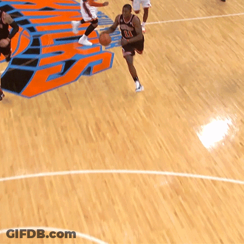 A Basketball Player With The Number 11 On His Jersey Is Dribbling The Ball GIF