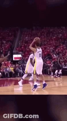 A Basketball Player With The Number 11 On His Jersey Is Playing Basketball GIF