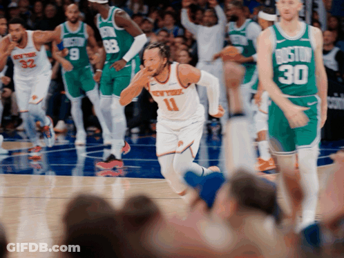 A Basketball Player With The Number 11 On His Jersey Runs On The Court GIF